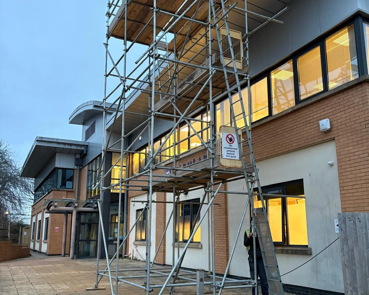 Scaffold access tower set up against the Wibli Wobli Nursery building in Newport during the solar PV installation.