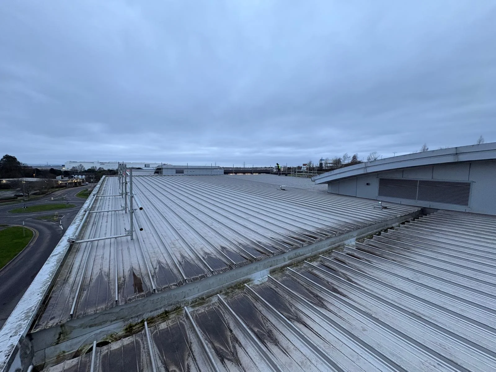 Commercial solar PV installation in progress on the metal roof of Wibli Wobli Nursery, Newport, ahead of a 35.7 kWp rooftop system.