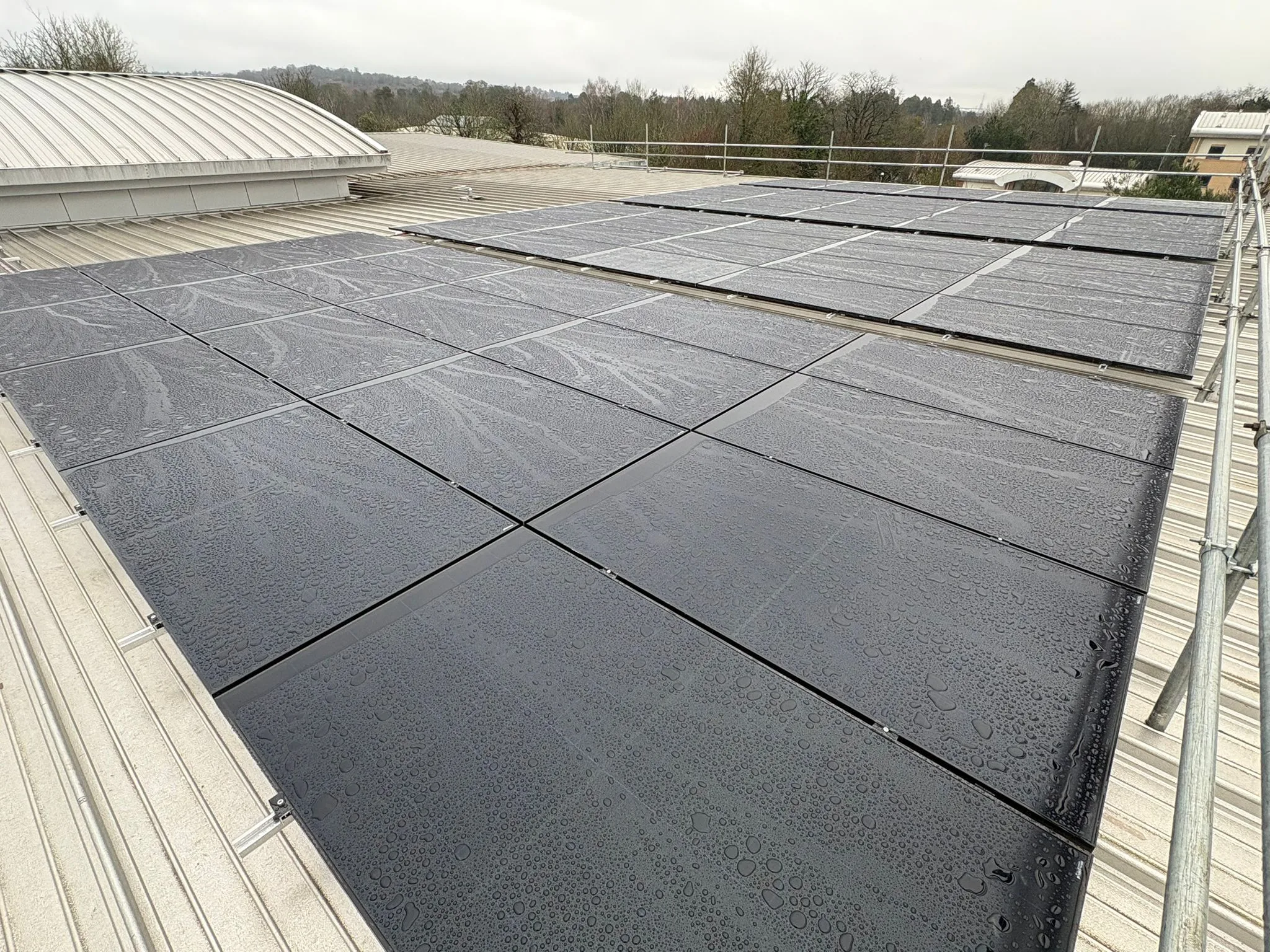 Completed commercial solar panel installation at Wibli Wobli Nursery, Newport, a 35.7 kWp rooftop array of 70 all-black AIKO panels.