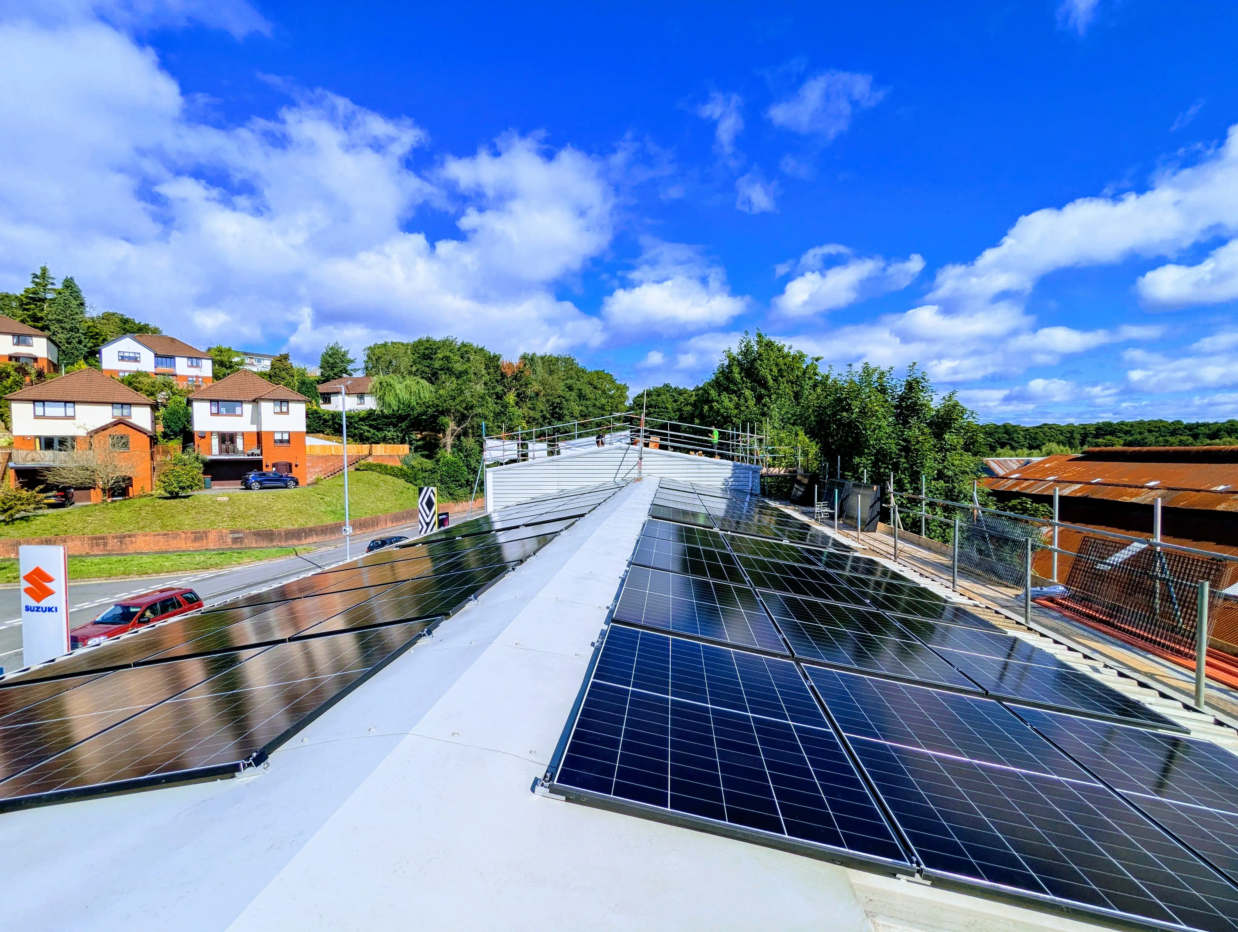 Rooftop solar PV installation at Ponthir Group car dealership, demonstrating commercial solar deployment for the automotive retail sector.