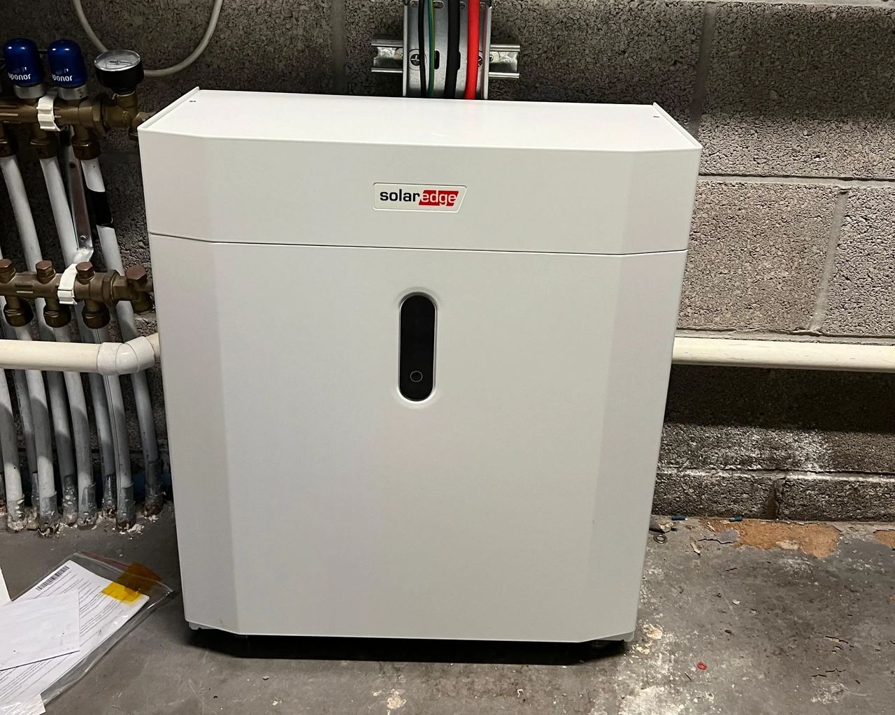 SolarEdge Home Battery installed in a property plant room as part of a hybrid solar PV and battery storage system