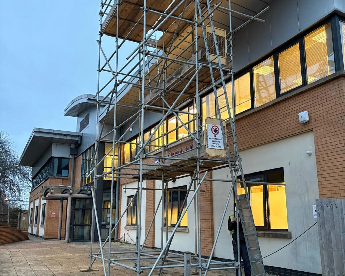 Scaffold access tower set up against the Wibli Wobli Nursery building in Newport during the solar PV installation.