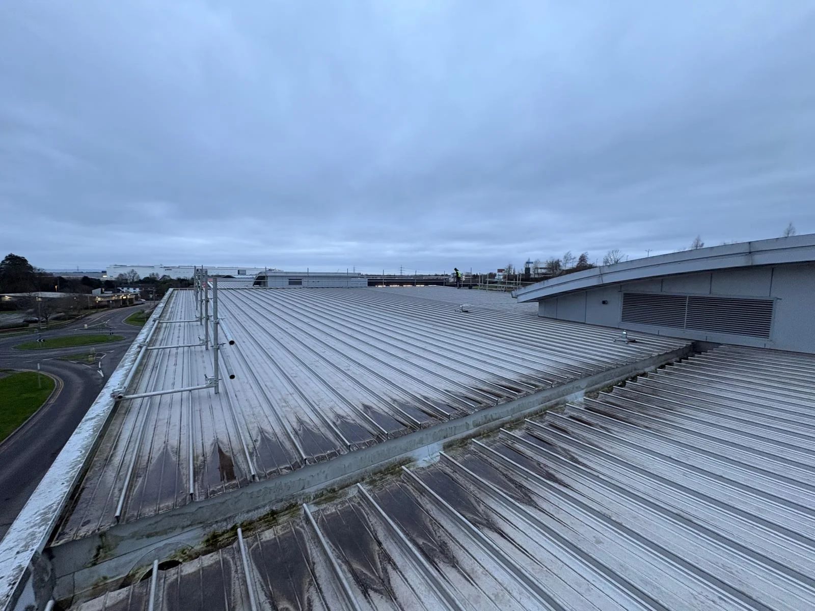 Commercial solar PV installation in progress on the metal roof of Wibli Wobli Nursery, Newport, ahead of a 35.7 kWp rooftop system.