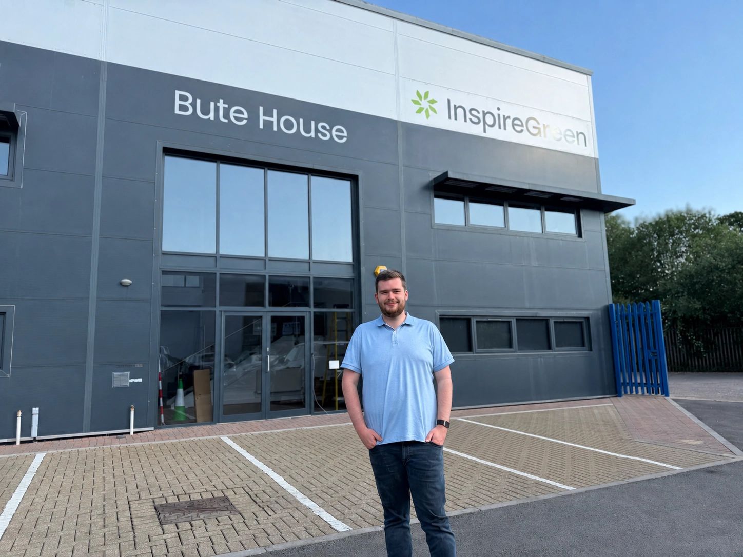 Josh Powell, Founder and CEO of InspireGreen, standing outside the company's new headquarters at Bute House, Lamby Way, Cardiff.